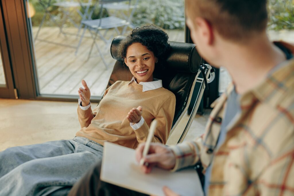 Yorkshire Counselling Services - Female-patient-talks-about-her-problems-while-lying-on-couch-at-psychologist-appointment-advanced-somatic-emdr
