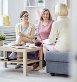 cheerful-women-chatting-PA8KTYC2-1-pejxxaf8raog959ucx25avvwpt18iryngzt3ebga8k